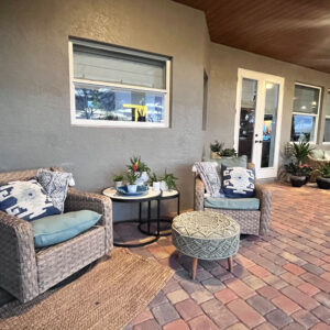 A patio with two chairs and a table