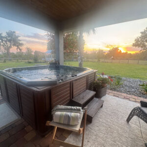 A hot tub sitting on top of a patio.