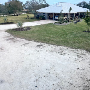 A large white tent in the middle of a field.