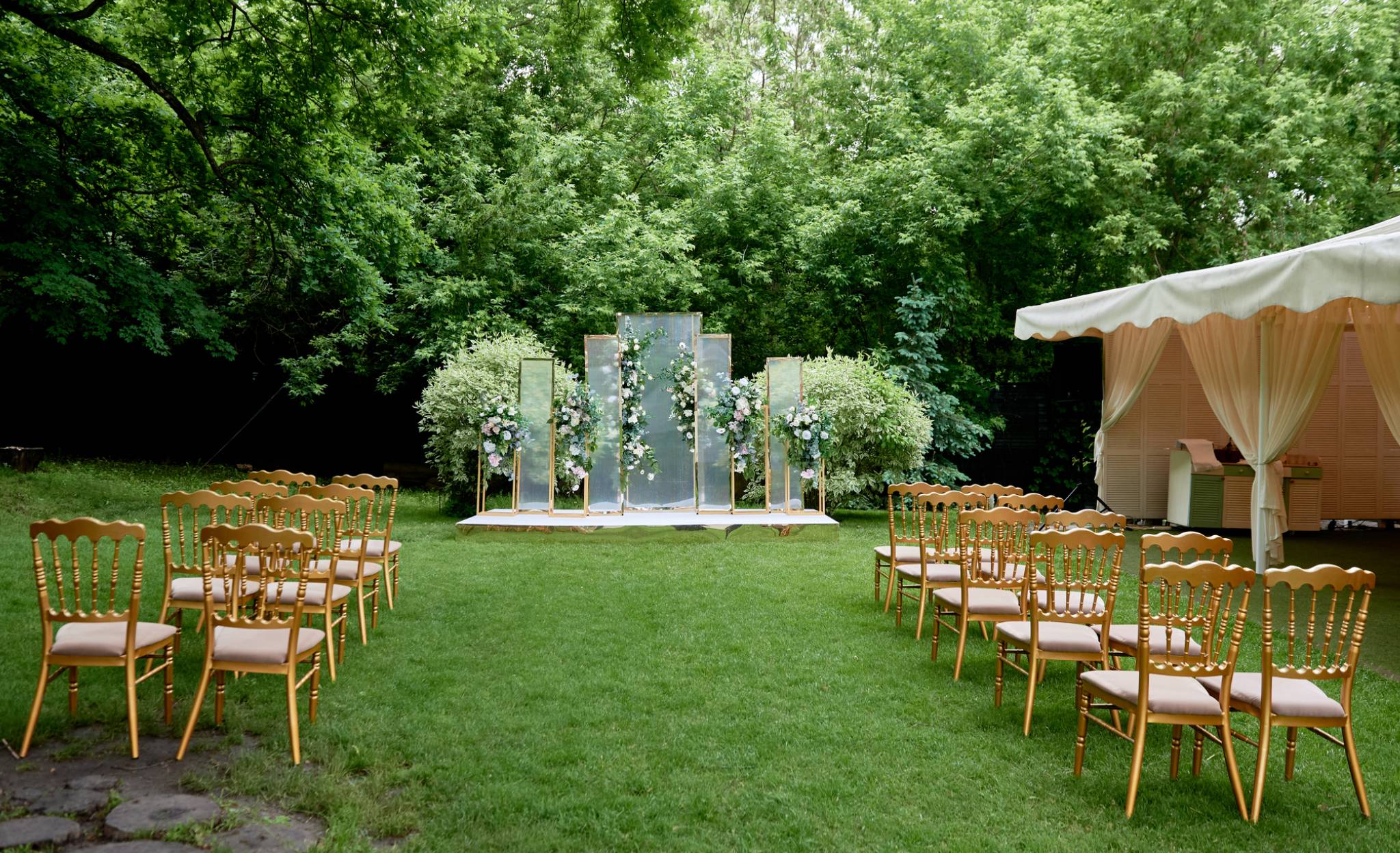 A wedding ceremony in the middle of an open field.